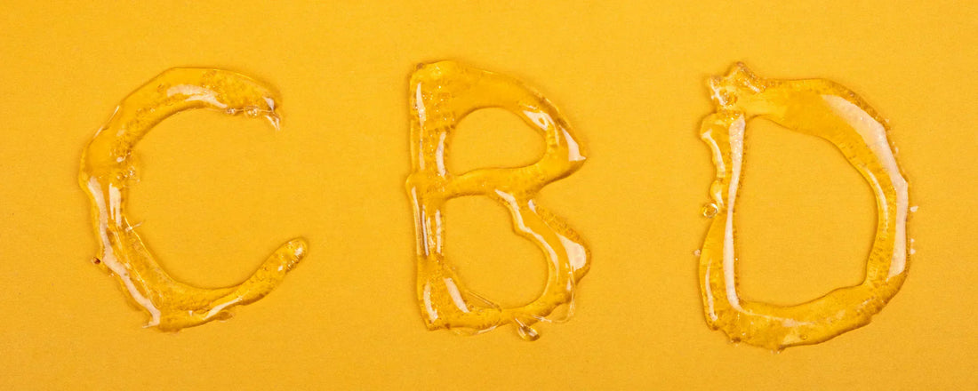 The letters 'CBD' printed in CBD wax