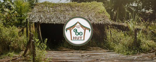 The CBD Hut logo with a picture of a wooden hut in the background