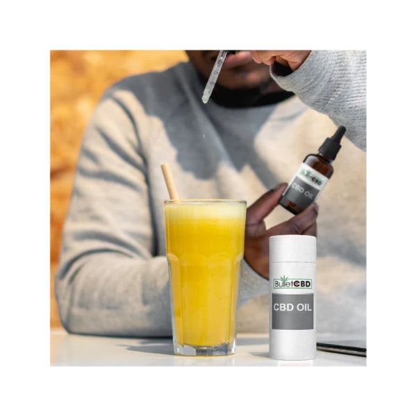 Bullet CBD Oil drops into orange juice | The CBD Hut