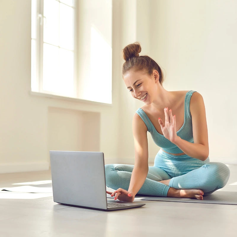 Fitness coach greeting customers via video call