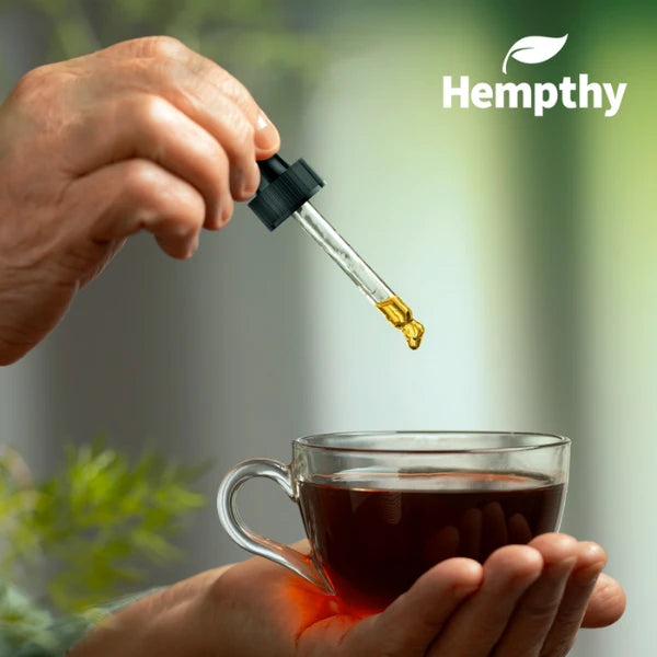 Hempthy CBD oil drops into a cup of tea | The CBD Hut