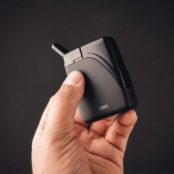 Someone holding a Nebula Fuzion Dry Herb Vapourizer | The CBD Hut