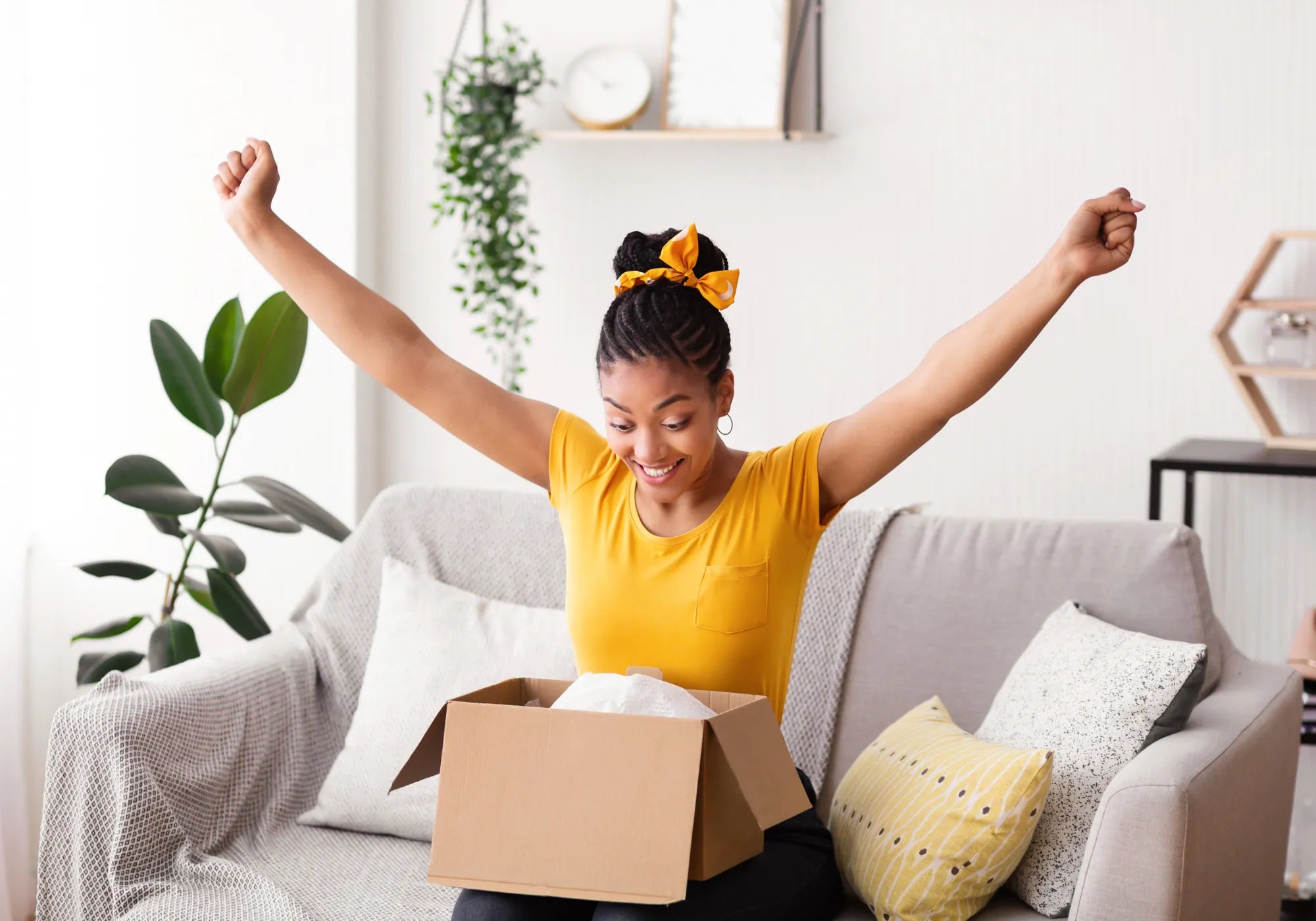 Happy customer receiving parcel after making her first purchase with The CBD Hut