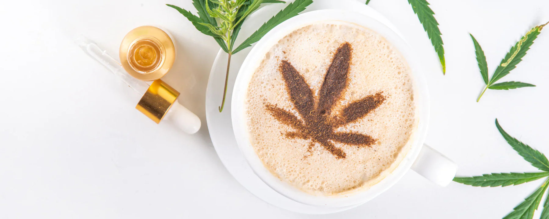 CBD-infused coffee with a hemp leaf design in the coffee froth. The image also features a CBD tincture oil with hemp leaves surrounding the coffee cup