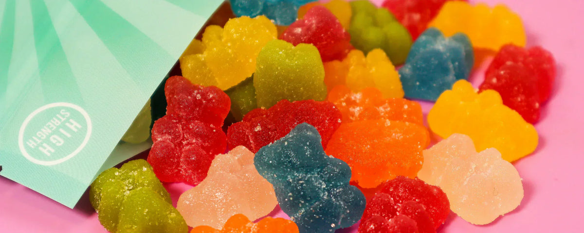 CBD gummy bears on a pink table