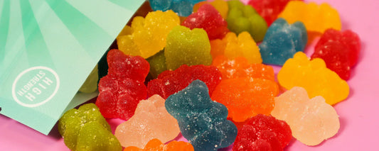 CBD gummy bears on a pink table