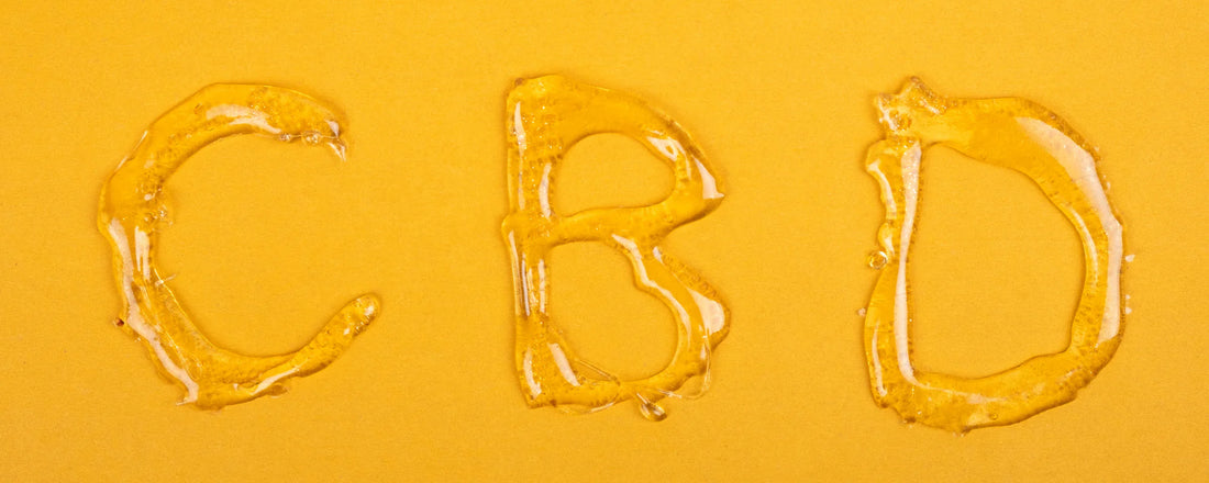 The letters 'CBD' printed in CBD wax