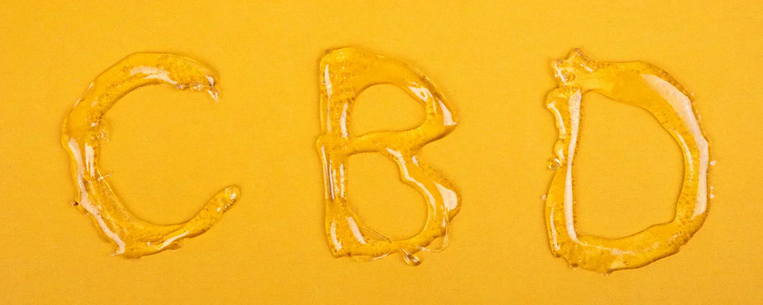 The letters 'CBD' printed in CBD wax