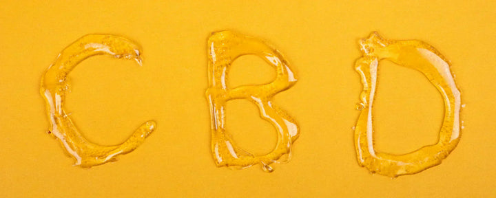 The letters 'CBD' printed in CBD wax