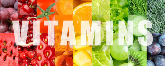 A selection of fruit and vegetables with text: 'VITAMINS'