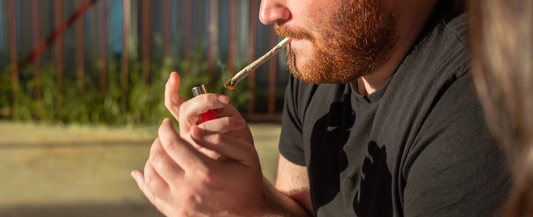 Man lighting up a joint