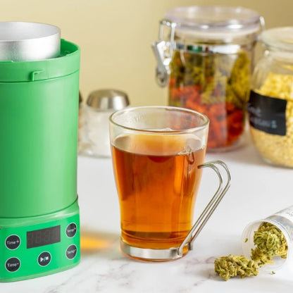Nebula Decarboxylator & Infuser with a cup of CBD-infused tea | The CBD Hut